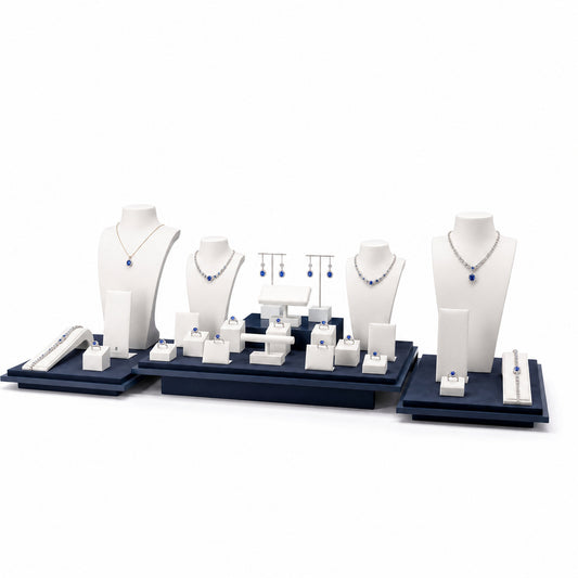 Custom Blue and White Three-Zone Wholesale Jewelry Display without the backboard, styled with necklaces, earrings, rings and bracelets across the coordinated display pieces