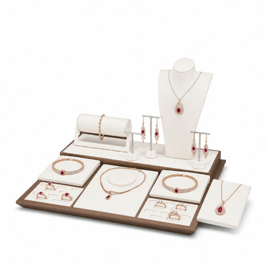 Custom Brown Split-Backdrop Jewelry Display Table Set without the backboard, styled with necklaces, earrings, rings and bracelets across the coordinated display pieces