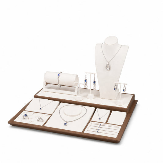 Custom Cream and Brown Jewelry Display Counter Set without the backboard, styled with necklaces, earrings, rings and bracelets across the coordinated display pieces