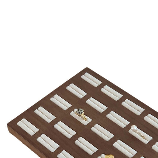 White background walnut wood ring display tray with velvet ring slots