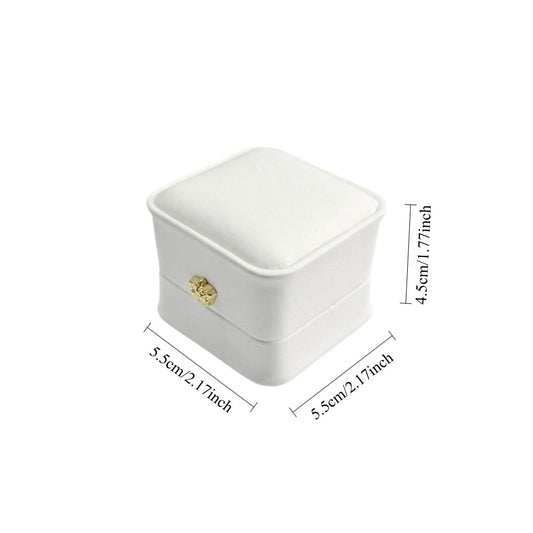 Jeweller Buy white single-ring presentation case with curved edges, hinged lid, and cushioned interior.