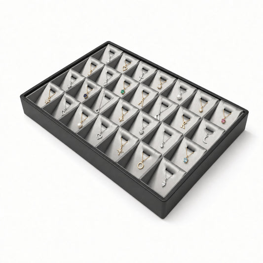 Silver gray 28-slot pendant necklace display tray filled with jewelry, angled view