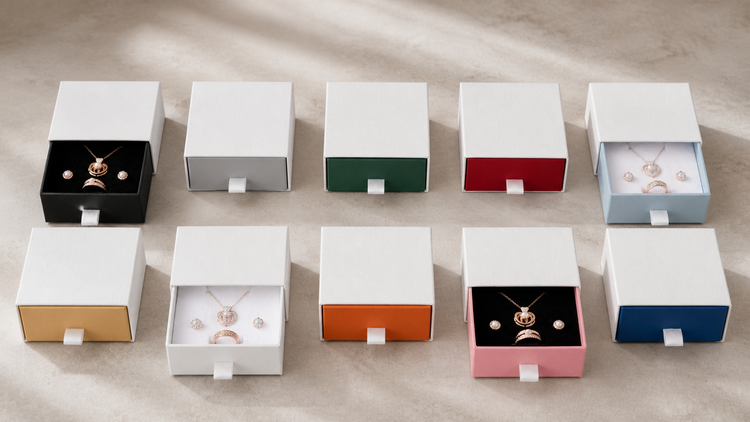 Ten B2533 drawer jewelry box colorways with white sleeves and black or white inserts on a boutique counter