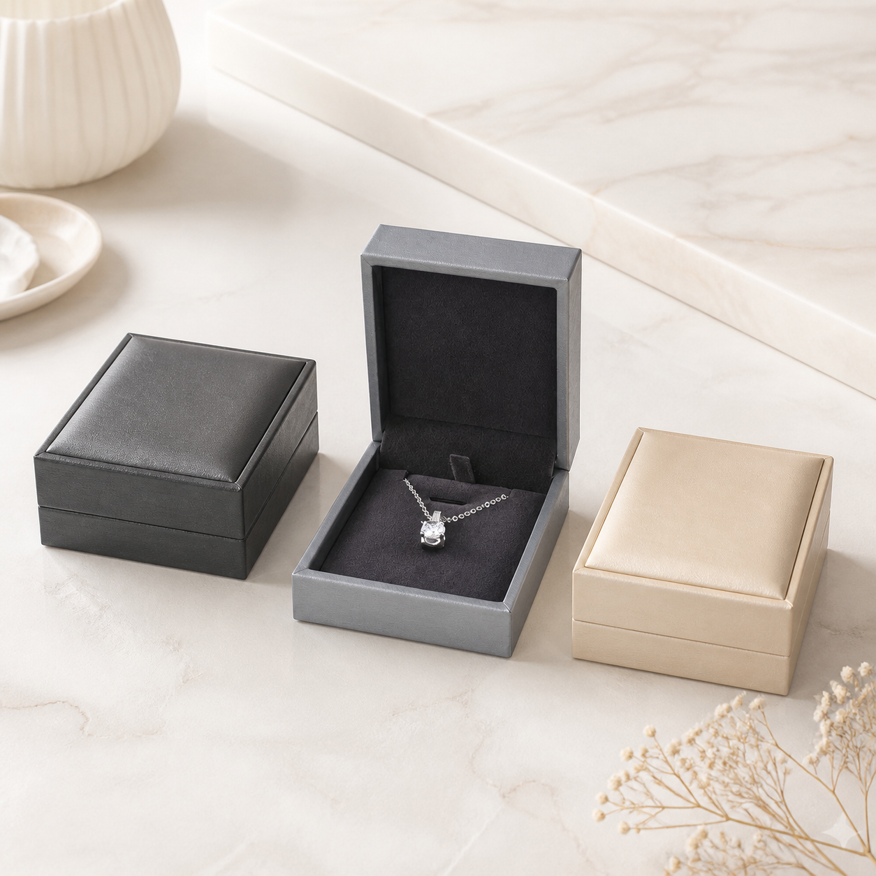 Bright black and gold pendant boxes arranged in a luxury showroom