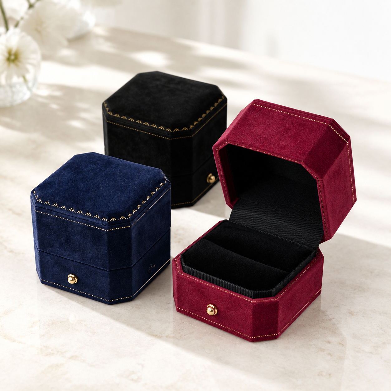 Bright premium velvet jewelry boxes arranged in a refined showroom