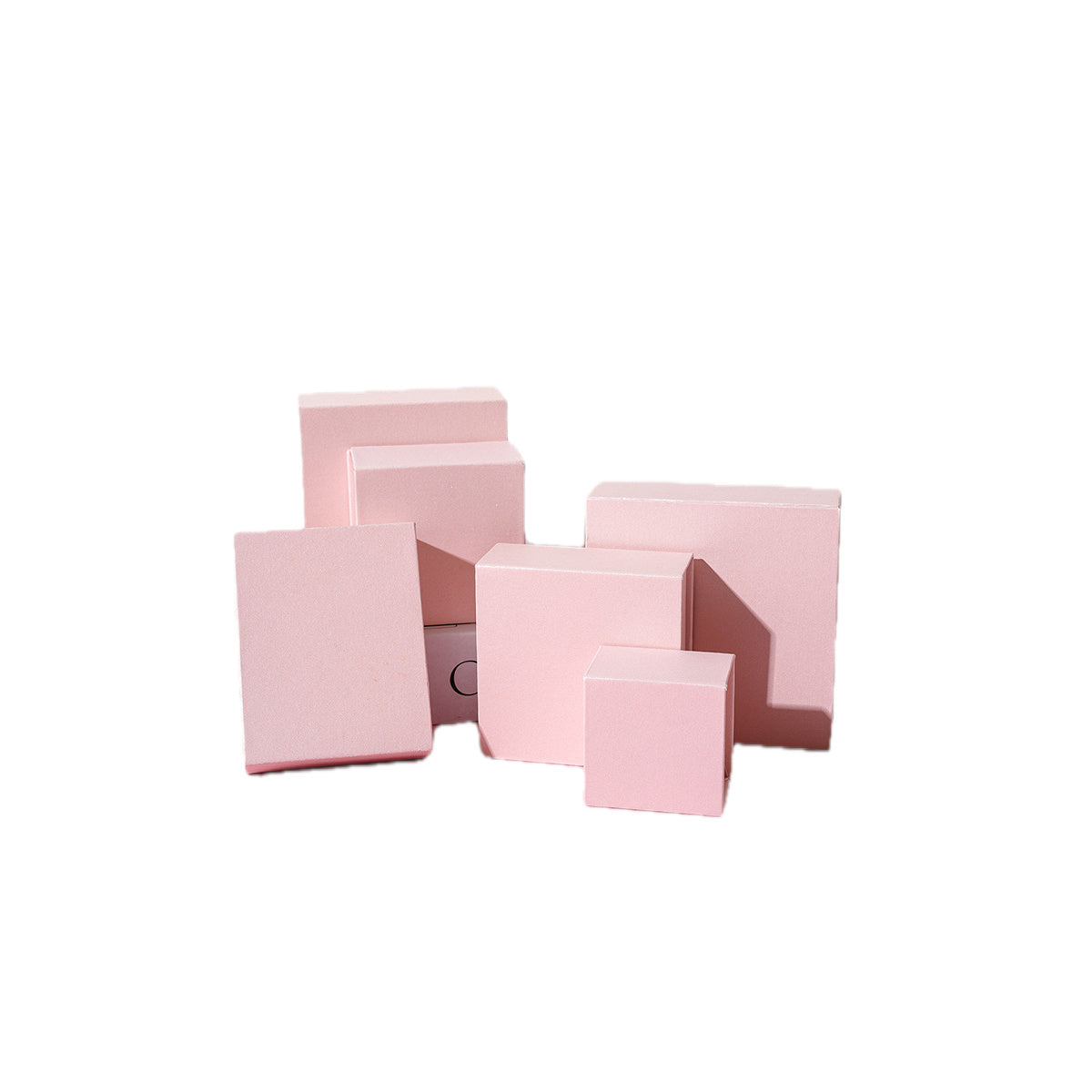 Custom pearl pink magnetic jewelry boxes on a pure white background