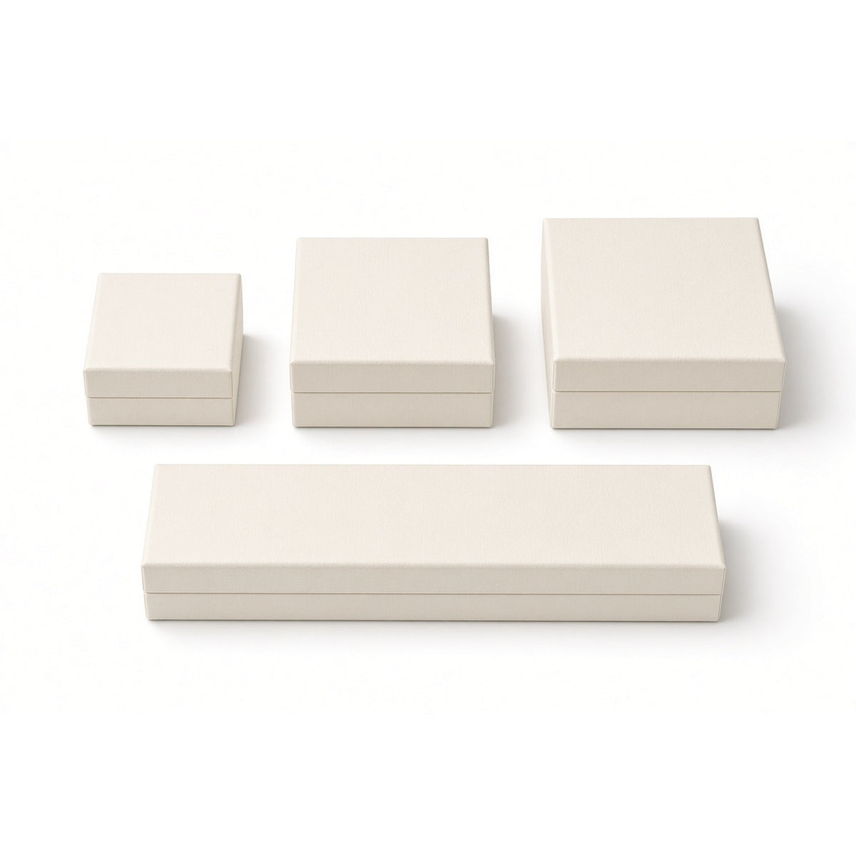Four off-white custom lid-and-base jewelry box sizes on white