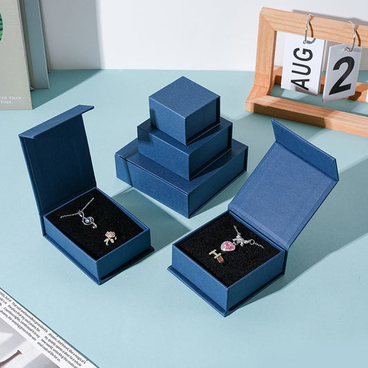 Custom deep navy magnetic jewelry box presentation view