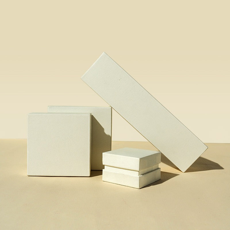 Off-white custom jewelry gift boxes in multiple sizes for rings and pendants