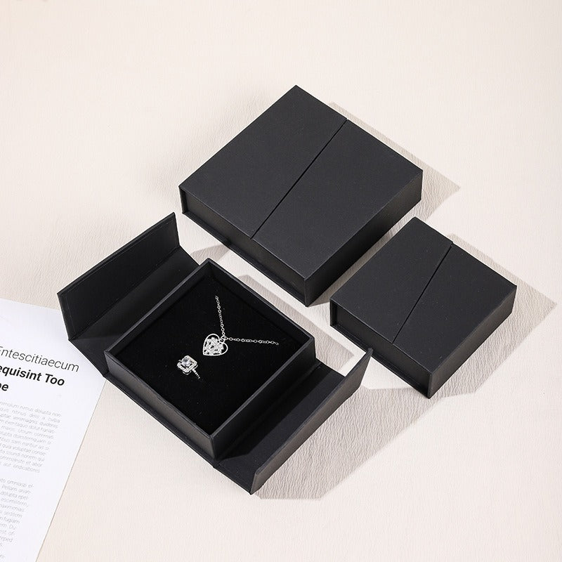 Black double-opening magnetic jewelry box shown open and closed