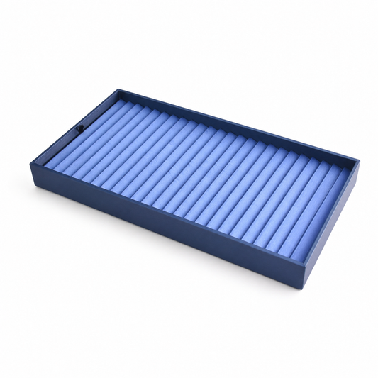 Angled blue jewelry tray display with padded rows for bracelets and bangles