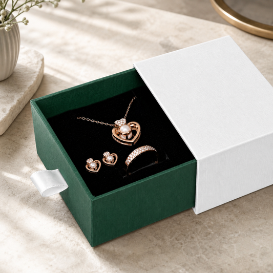 Green drawer box jewelry presented in a boutique jewelry-store display scene.