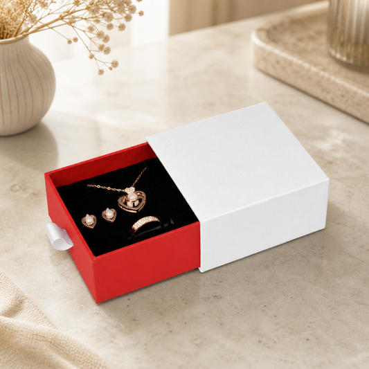 Red drawer gift jewelry box packaging presented in a boutique jewelry-store display scene.