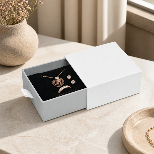 Silver white drawer box jewelry presented in a boutique jewelry-store display scene.