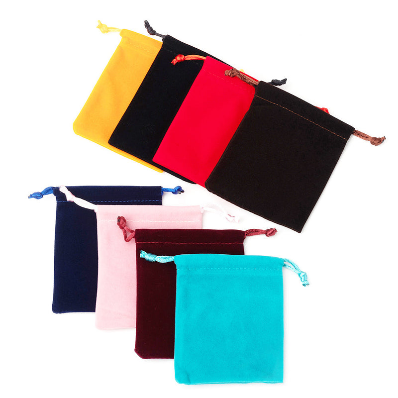 Colorful drawstring jewelry pouches on a white background
