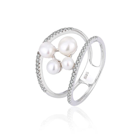 Minimalist simple irregular freshwater pearl engagement ring with diamonds around it