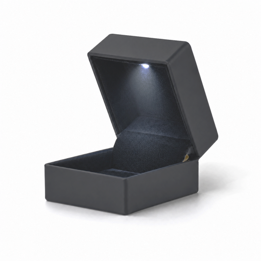 Open black metal LED ring box with a cool-white light and padded black insert