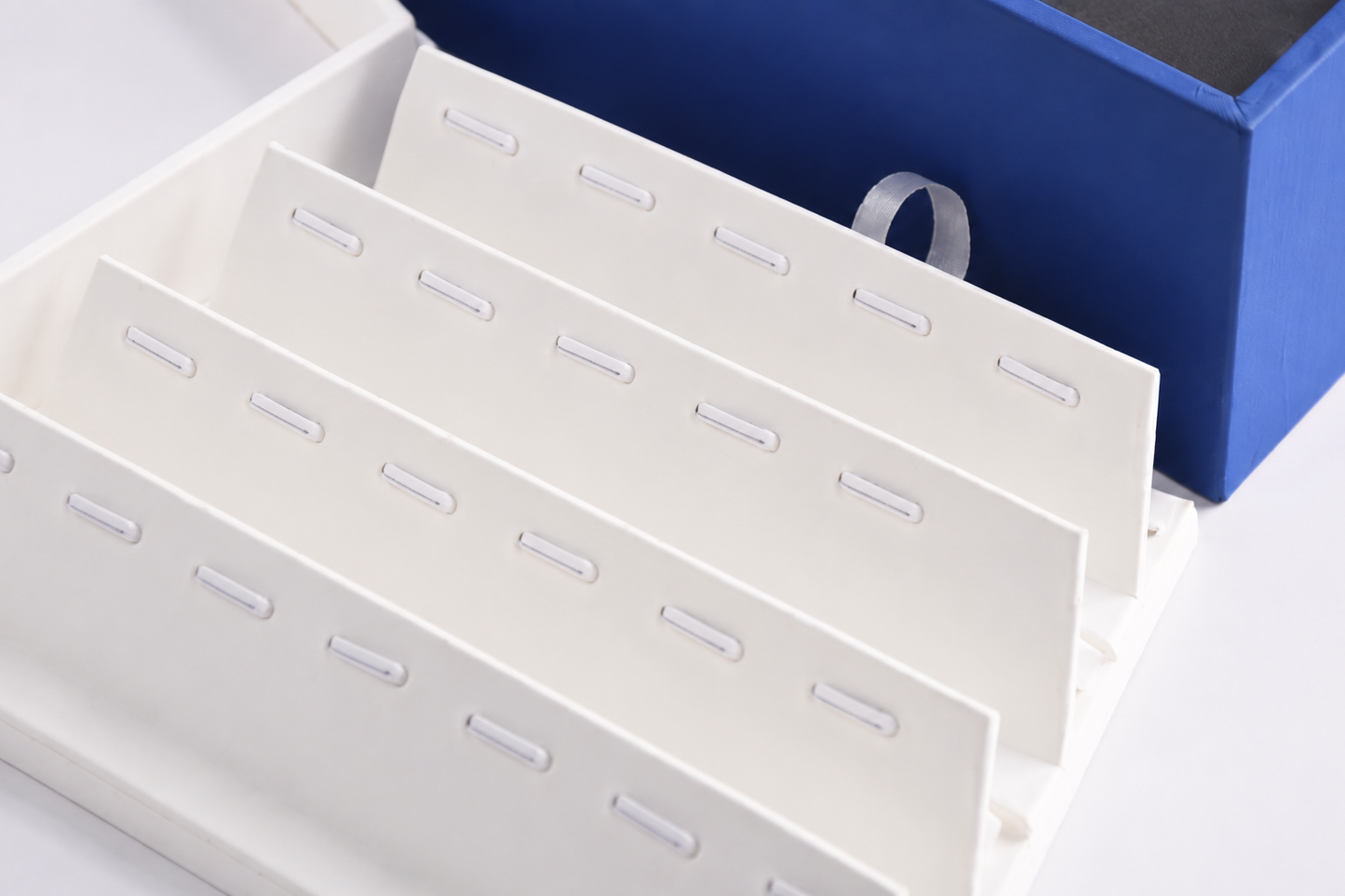 Small blue pendant display tray for retail showcases and sales counters