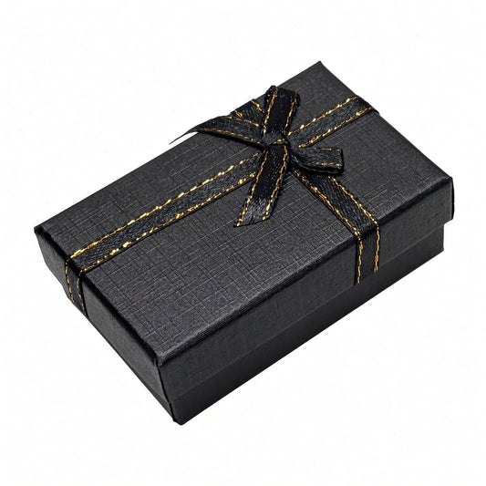 Closed black B2632 bow jewelry gift box on a pure white background