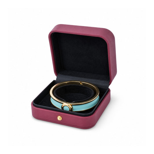 magenta PU bangle box open in a three-quarter view with a rigid bangle.