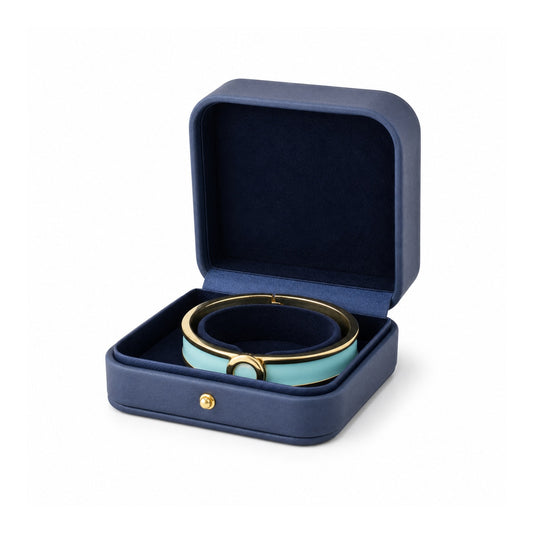 navy blue PU bangle box open in a three-quarter view with a rigid bangle.