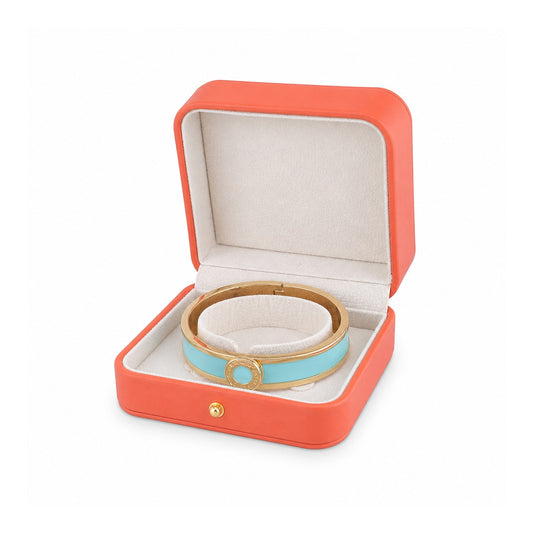 orange PU bangle box open in a three-quarter view with a rigid bangle.