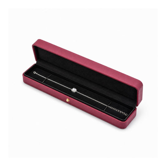 magenta PU bracelet box open in a three-quarter view with a bracelet.