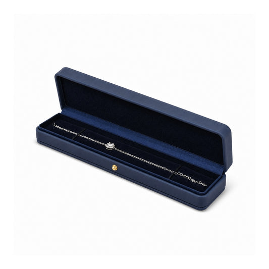 navy blue PU bracelet box open in a three-quarter view with a bracelet.