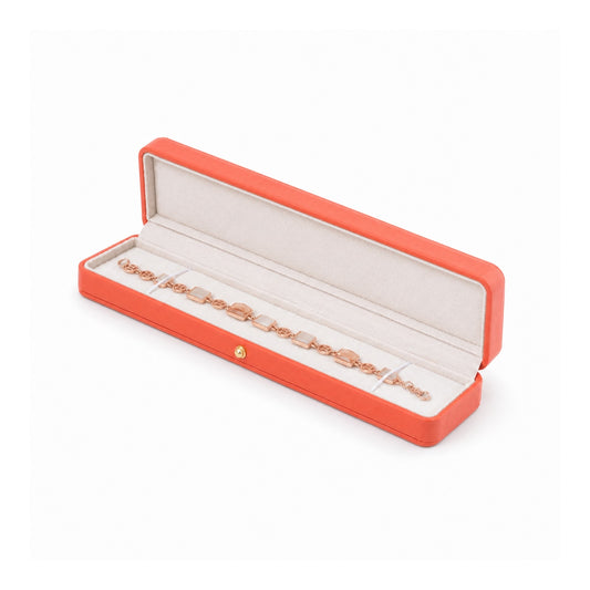 orange PU bracelet box open in a three-quarter view with a bracelet.