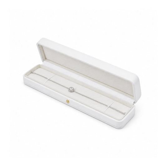 white PU bracelet box open in a three-quarter view with a bracelet.