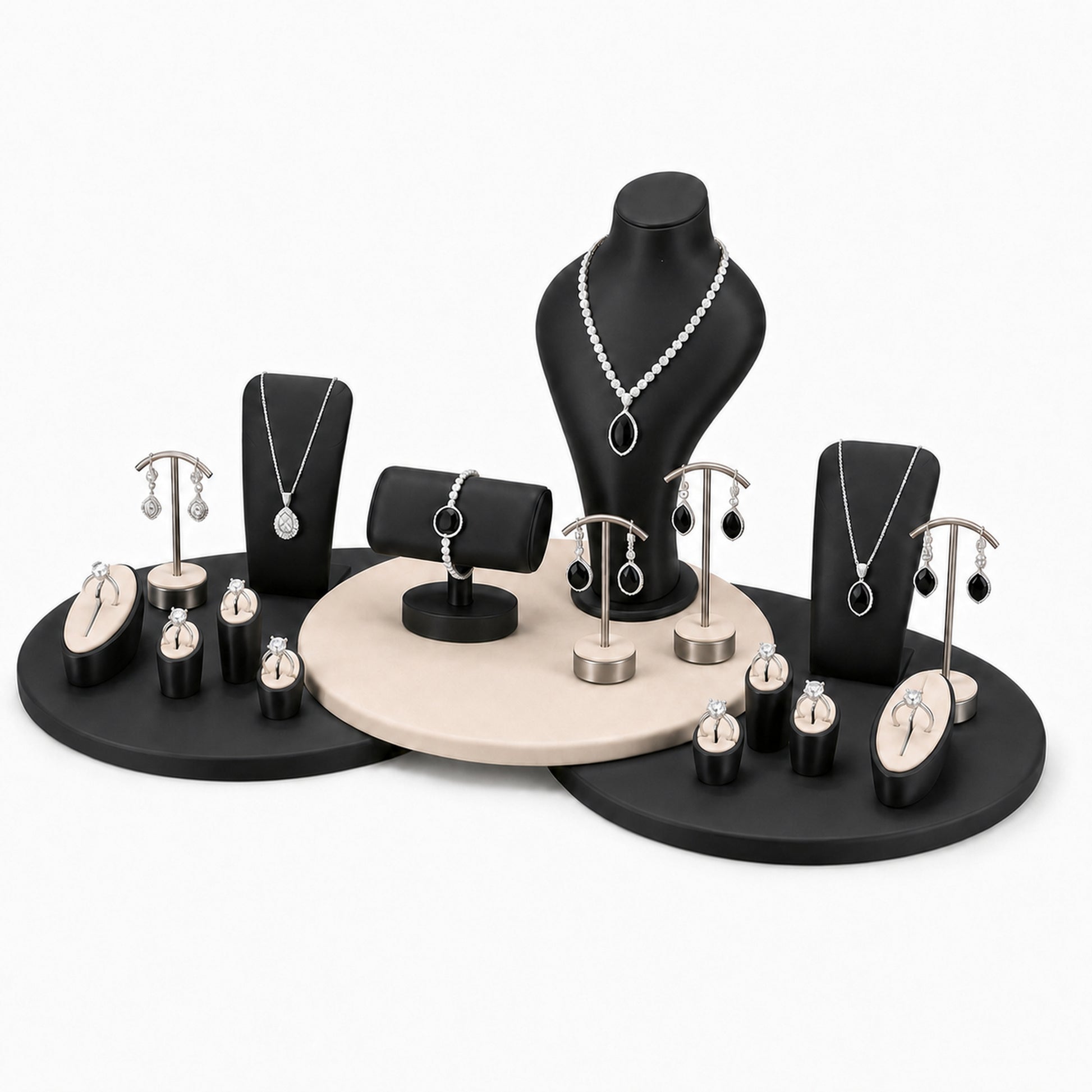 Custom Black Circular Platform Jewelry Display Rack Set without the backboard, styled with necklaces, earrings, rings and bracelets across the coordinated display pieces