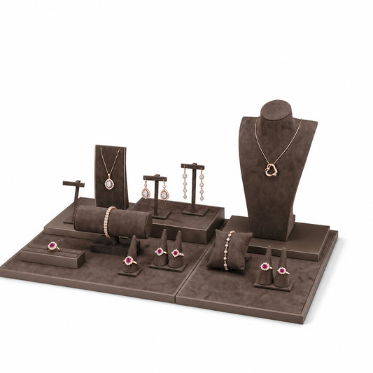 Custom Brown Quilted-Backdrop Jewelry Showcase Set without the backboard, styled with necklaces, earrings, rings and bracelets across the coordinated display pieces