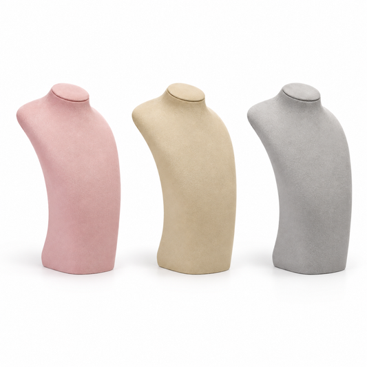 Curved velvet necklace display busts in pink, khaki and gray on a pure white background