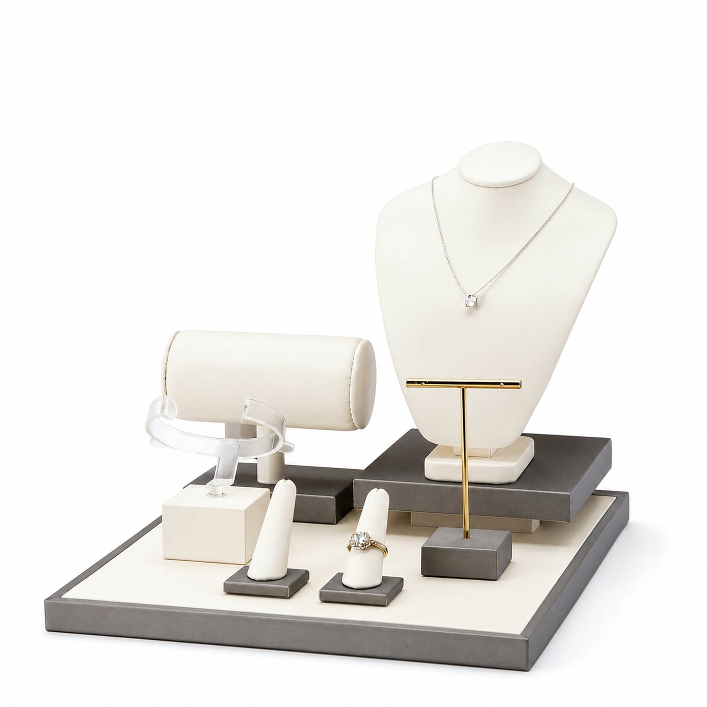 Custom Ivory Gray Multi-Level Jewelry Display Set without the backboard, showing necklace bust, bracelet roll, T-bar, ring stands and tiered platforms for configuration review