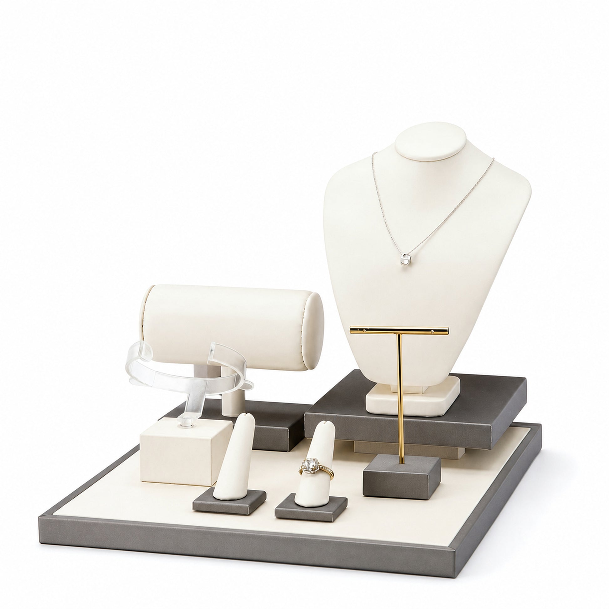 Custom Ivory Gray Multi-Level Jewelry Display Set without the backboard, showing necklace bust, bracelet roll, T-bar, ring stands and tiered platforms for configuration review