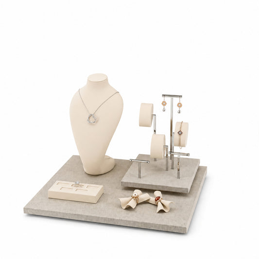 Custom Neutral Curved-Backdrop Retail Jewelry Display shown without the backboard in a light neutral tones arrangement with jewelry visible on the display pieces