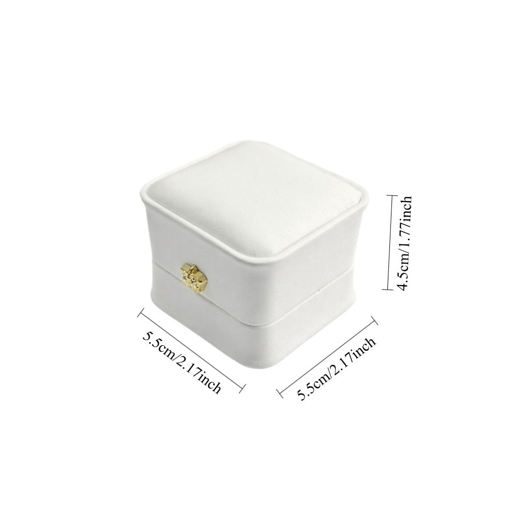 Jeweller Buy white single-ring presentation case with curved edges, hinged lid, and cushioned interior.