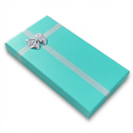 Closed lake blue paper necklace box with silver ribbon and bow
