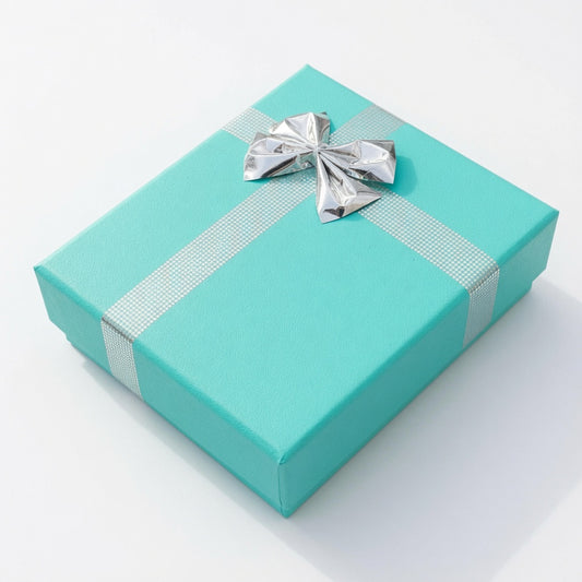 Closed lake blue paper pendant box with silver ribbon and bow