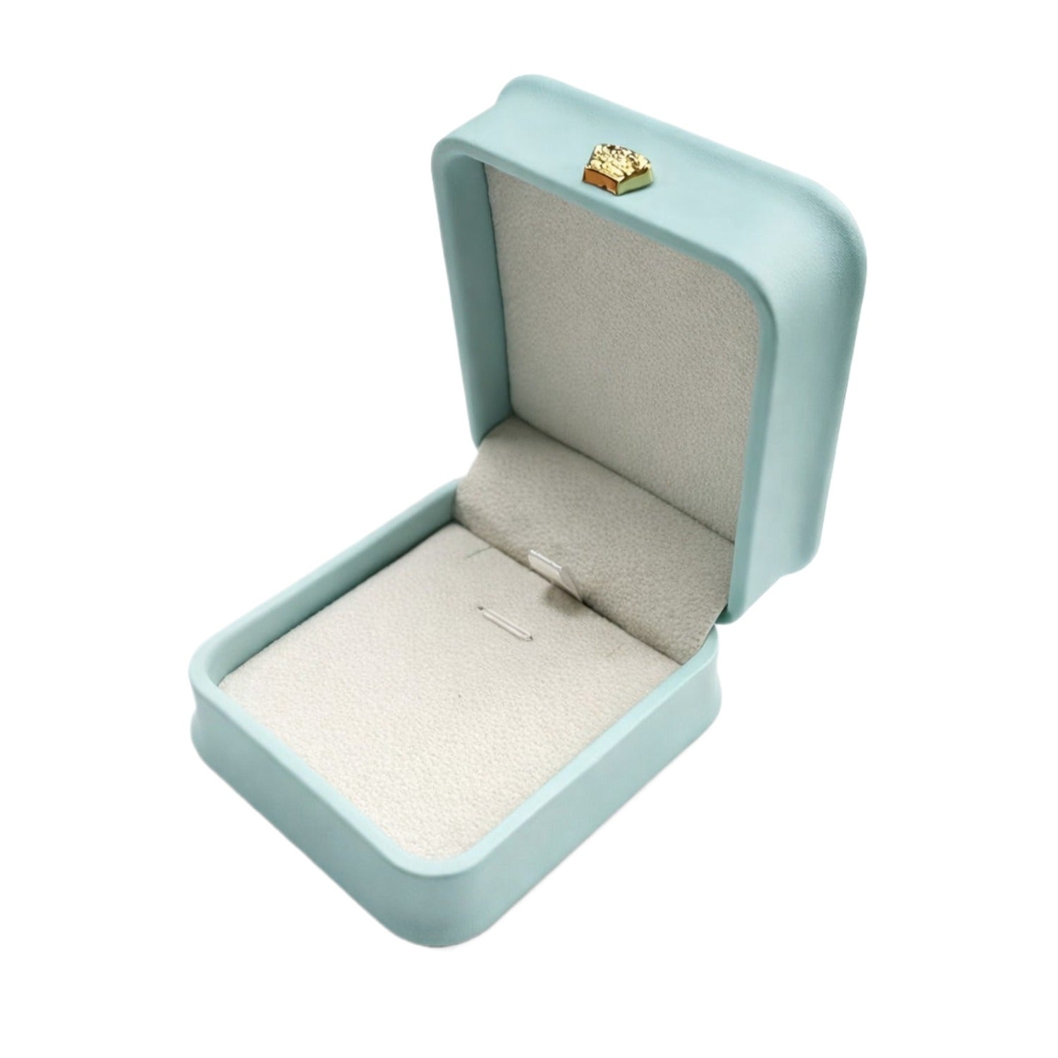 Open Tiffany Blue rounded pendant box with a pale padded interior, jewelry securing loops, and gold-tone ornament.