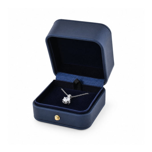 navy blue PU pendant box open in a three-quarter view with a pendant and chain.