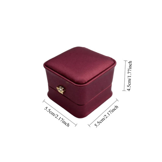 Jeweller Buy 12-pack burgundy ring gift boxes with hinged lids, cushioned interiors, and gold-tone accents.