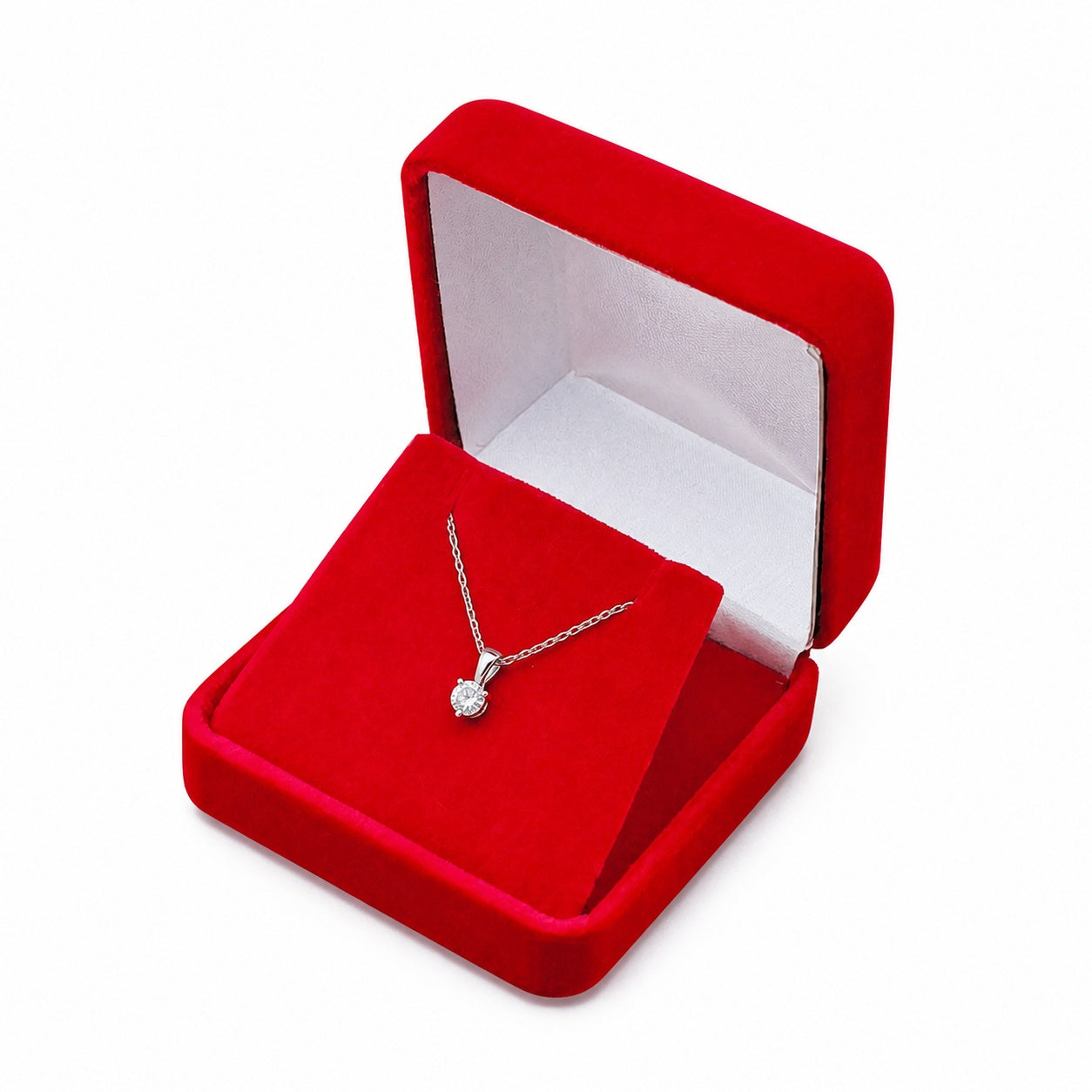 One open red square velvet pendant box displaying jewelry