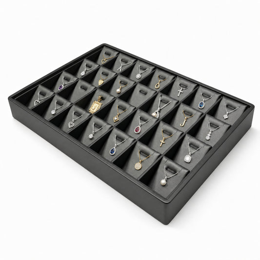 Black 28-slot pendant necklace display tray filled with jewelry, angled view