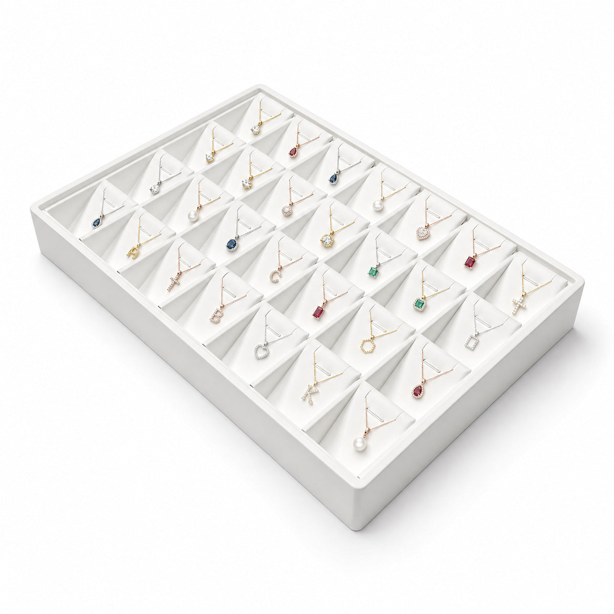 White 28-slot pendant necklace display tray filled with jewelry, angled view