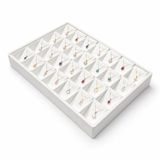 White 28-slot pendant necklace display tray filled with jewelry, angled view